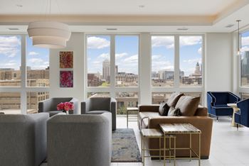 A living room with a view of the city.